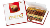 Box of Merci chocolate bars with a red and white design